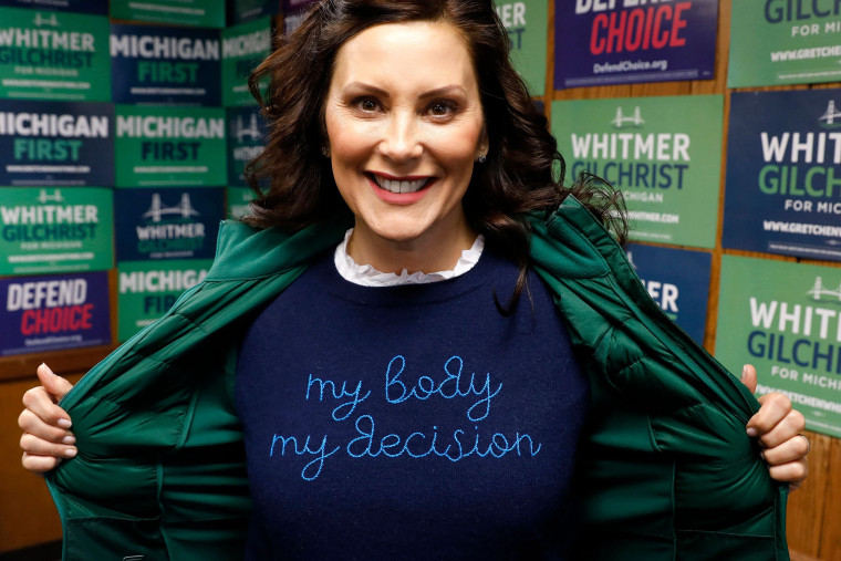 Gov. Gretchen Whitmer shows a "My Body My Decision" shirt at the 14th District Democratic Headquarters, during the US midterm election in Detroit, Michigan, on November 8, 2022. 