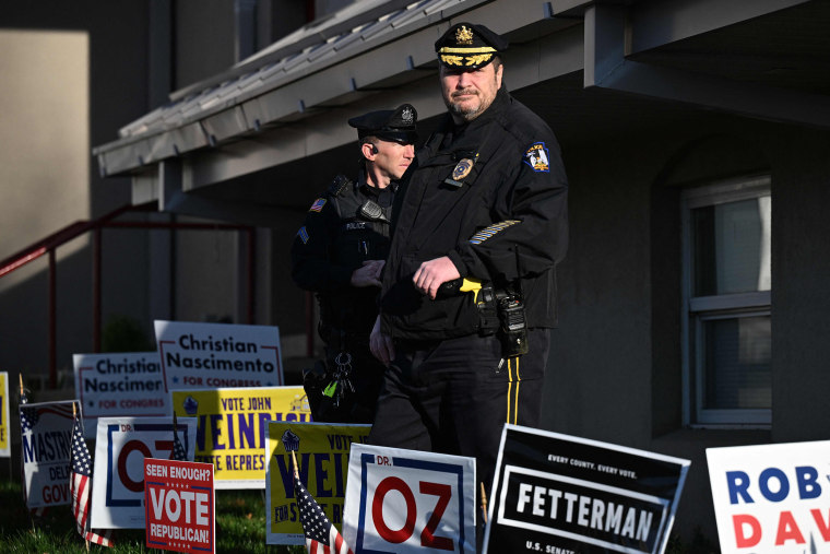 Police provide security at a polling station in Bryn Athyn, Pa.,