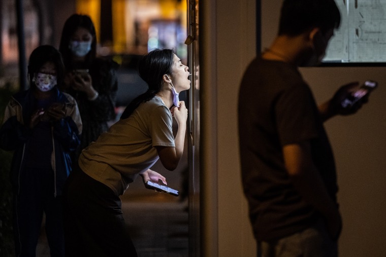People wait in line for Covid-19  tests during a new round of citywide antigen and nucleic acid testing in Guangzhou, China, on on Oct. 31, 2022.