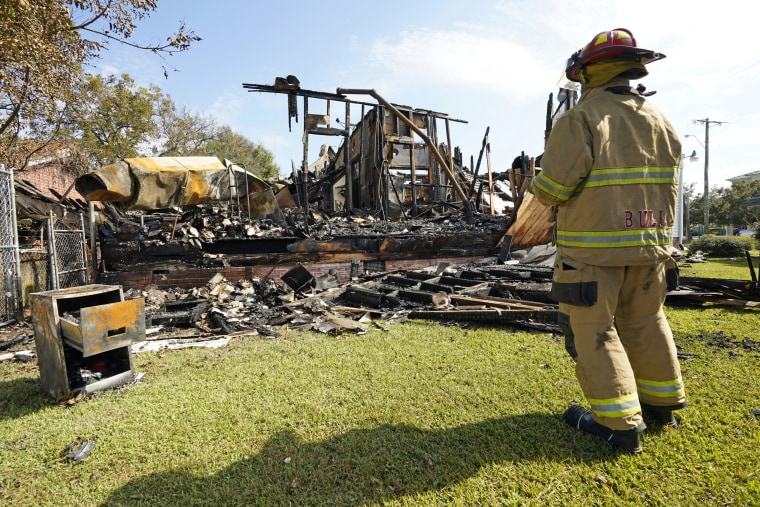 A fireman observes the remains of a burned Epiphany Lutheran Church