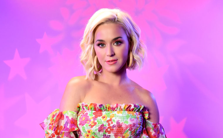 Katy Perry in pink lighting.