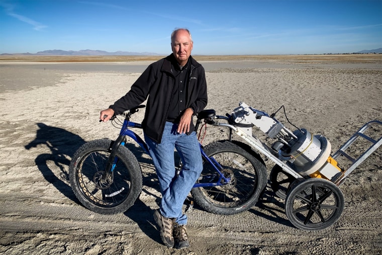 Dust researcher Kevin Perry poses with his fat bike and a PI-SWERL machine, which can measure wind erosion and dust emission.