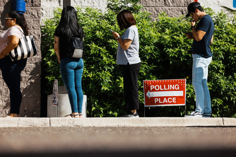 Voters wait in line outside a polling location in McAllen, Texas on Nov. 8, 2022.
