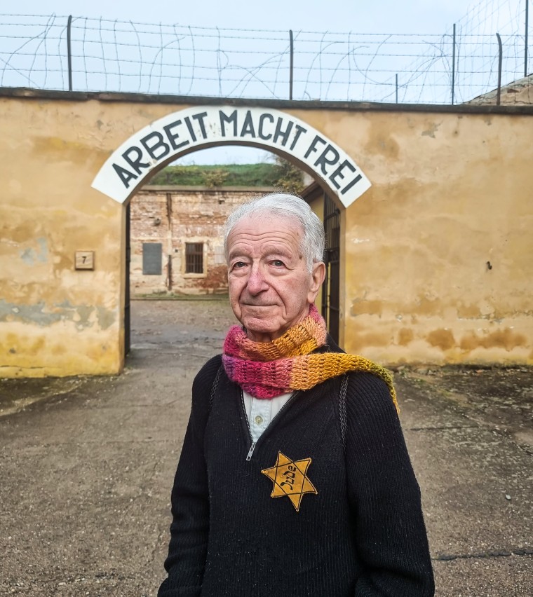 Gidon Lev at the gates to the courtyard of the small fortress of Theresienstadt, a Concentration camp in the Czech Republic, on Oct. 24, 2022