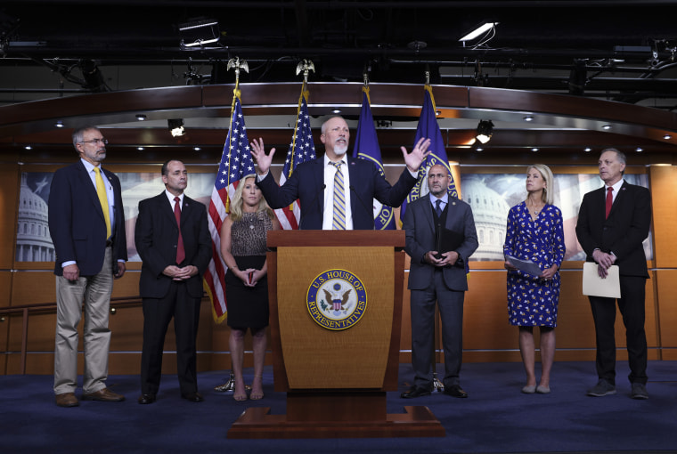 Rep. Chip Roy, joined by fellow Freedom Caucus members, speaks at a news conference