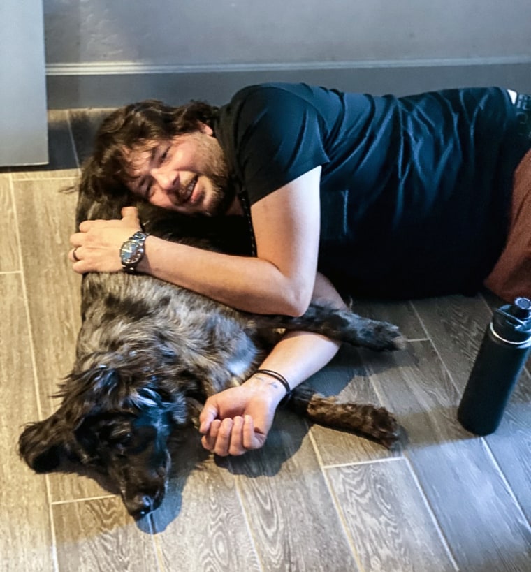 José Romero, a 42-year-old Army veteran who served in Afghanistan and Iraq, with Puppy — an Australian shepherd.