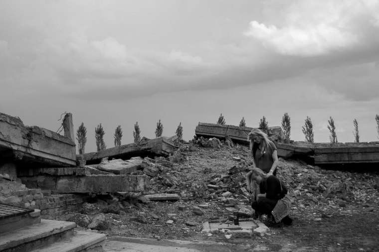 Montana Tucker filming for her how "How to: Never Again" series at Auschwitz Birkenau, a Concentration camp in Oświęcim, Poland.