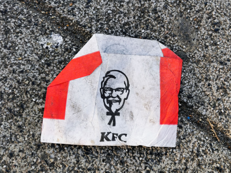 An empty KFC bag for French Fries on a sidewalk in Poland. 