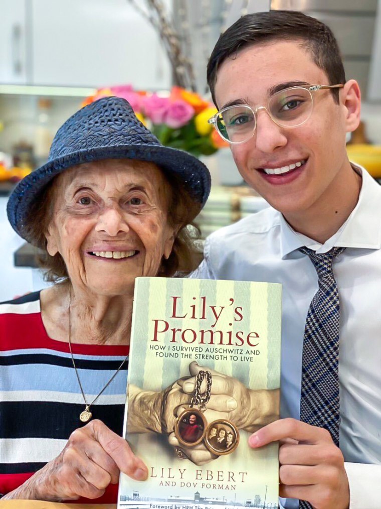 Dov Forman and his great-grandmother Lily Ebert holding their book "Lily's Promise."