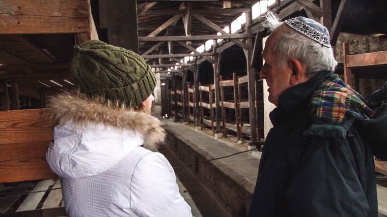 Rachel and her Grandfather Karl Shapiro visit the wooden stable-barracks at Auschwitz-Birkenau in a scene in "The Barn"