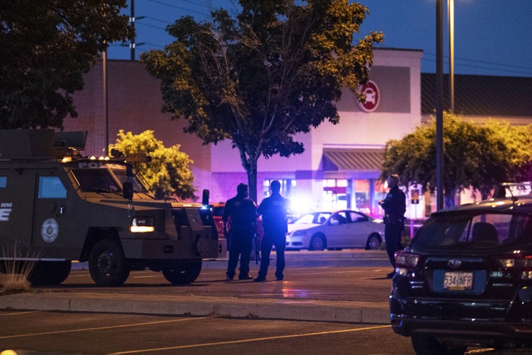Emergency personnel respond to a shooting at the Forum shopping center