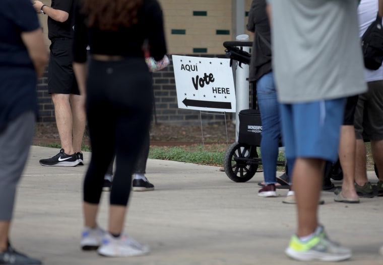 People line up to vote outside a polling station in San Antonio, Texas