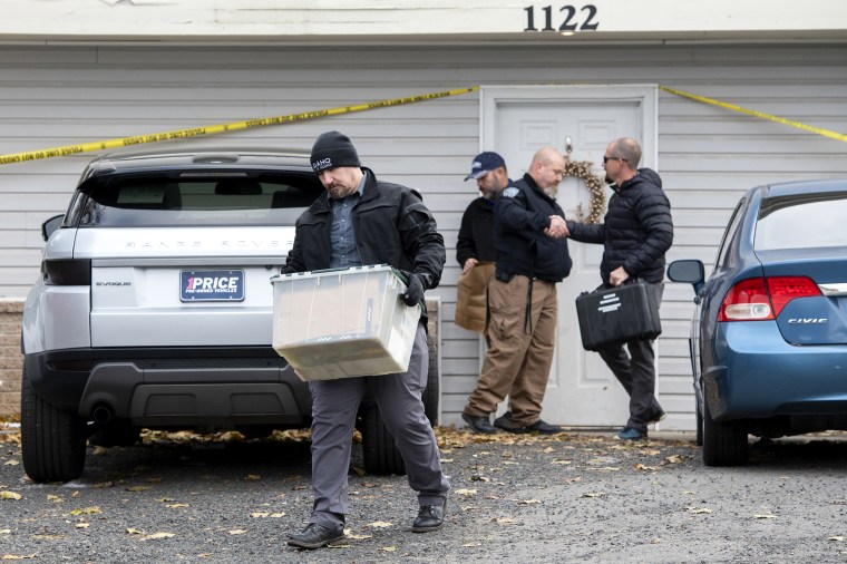 Officers investigate the deaths of four University of Idaho students at an apartment complex south of campus on Nov. 14, 2022, in Moscow, Idaho. 