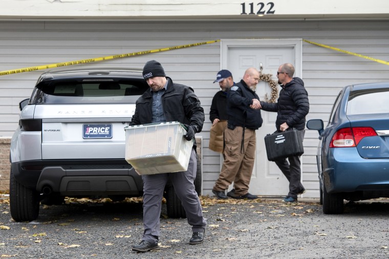 Officers investigate the deaths of four University of Idaho students at an apartment complex south of campus on Nov. 14, 2022, in Moscow, Idaho.