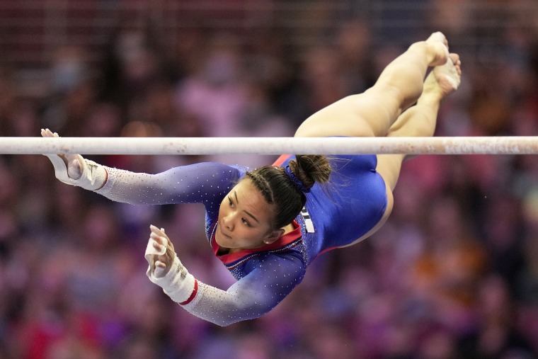 Suni Lee competes on the uneven bars during the women's U.S. Olympic Gymnastics Trials Friday, June 25, 2021, in St. Louis.