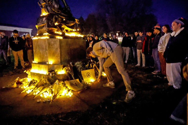 Students and community members gather for a candlelight vigil after a shooting that left three students dead the night before at the University of Virginia on Nov. 14, 2022.