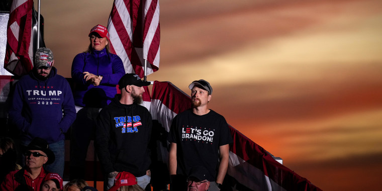 Image: Supporters of Donald Trump wearing t-shirts that read "TRUMP 2024" and "Let's go Brandon".