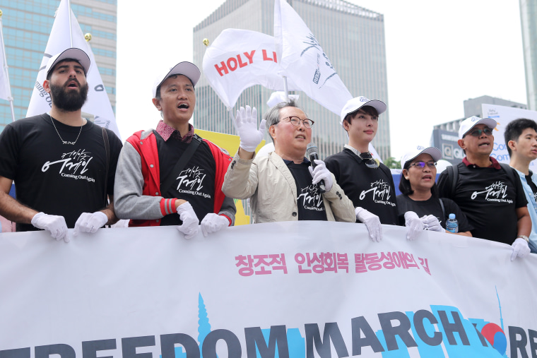 Pastor Yonah Lee, center, leads an "ex-gay" march in Seoul.