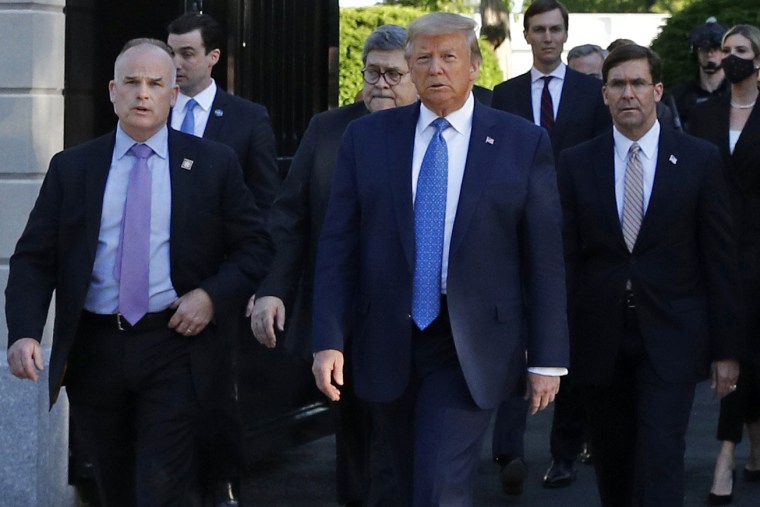 Secret Service agent Robert Engel, left, the head of then-President Donald Trump's detail, accompanies Trump as he departs the White House to stand outside St. John's Church, in Washington, June 1, 2020.