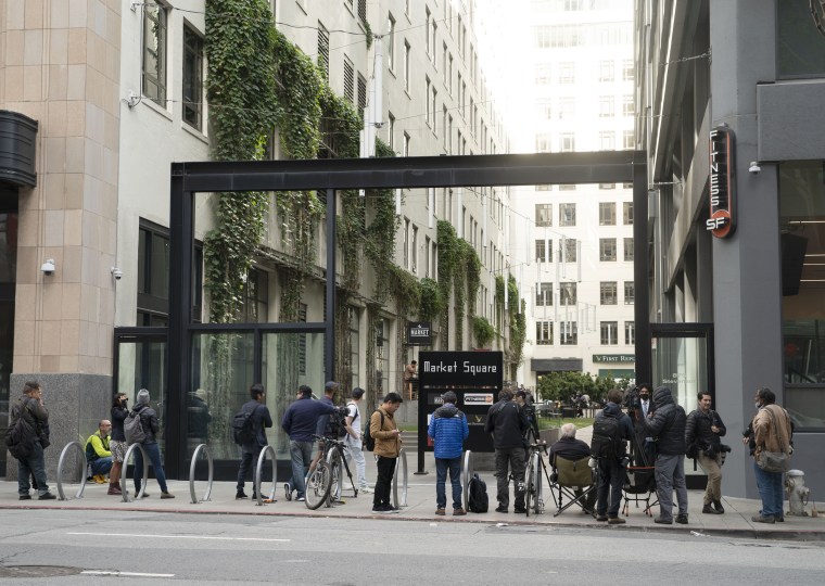 Reporters gather outside Twitter headquarters in San Francisco