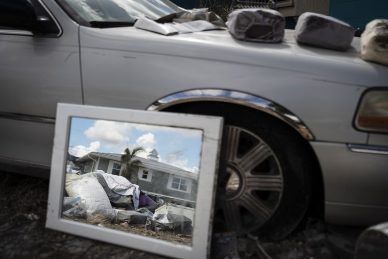 Debris in front of a home in Myers Beach, Fla.