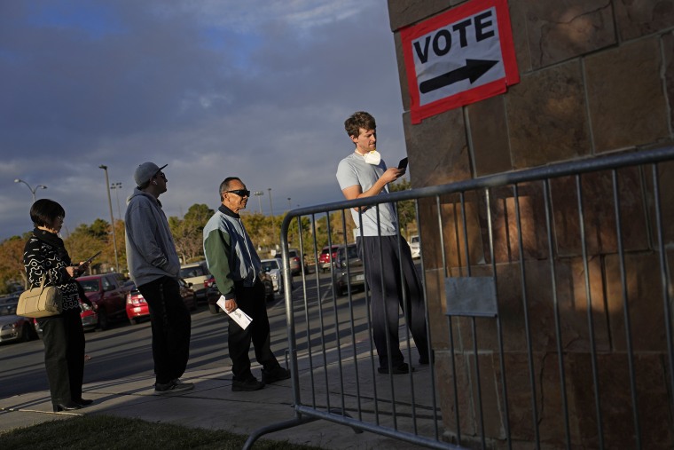 People wait to vote at a polling place in Las Vegas on Nov. 8, 2022.