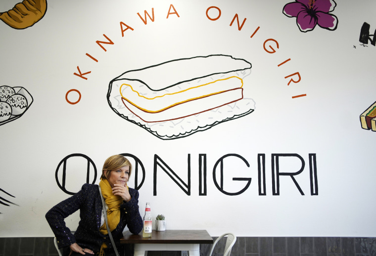 Rep. Susie Lee, D-Nev., waits for food while visiting O.Onigiri during a tour of AAPI small businesses in Las Vegas on Nov. 3