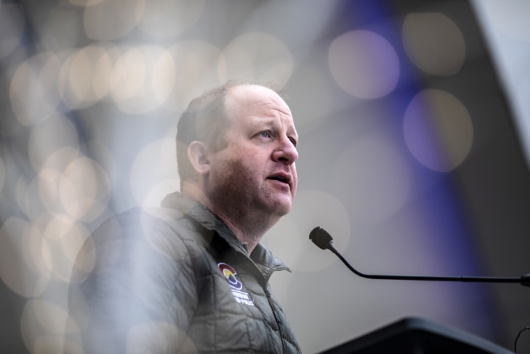 Colorado Gov. Jared Polis speaks at a day of remembrance event on the anniversary of the mass shooting at a King Soopers grocery story in Boulder on March 22, 2022.