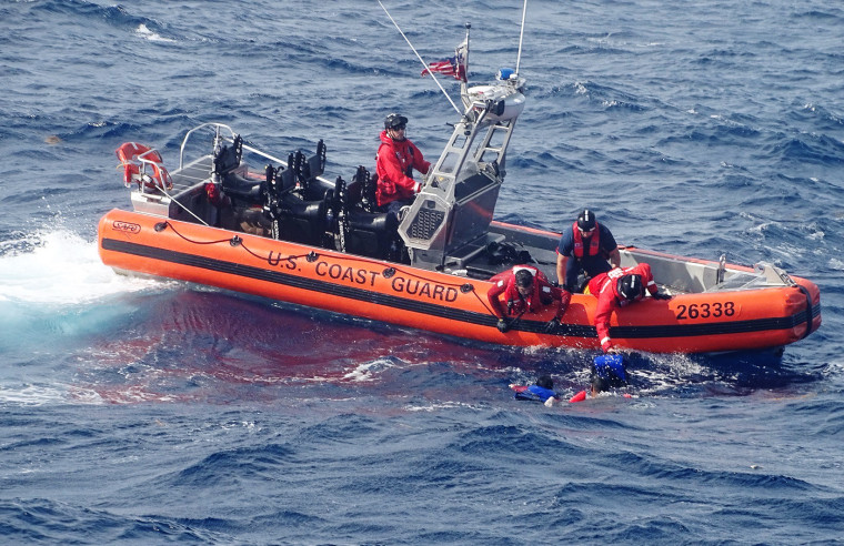 A Coast Guard boat rescues migrants on Nov. 19, 2022.