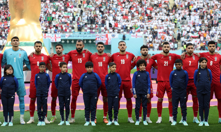Iran players listen to the national anthem ahead of the Qatar 2022 World Cup Group B football match between England and Iran at the Khalifa International Stadium in Doha