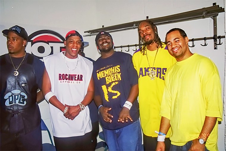 Lenny Santiago, right, hanging out with friends and artists backstage during a Hot 97 Summer Jam concert.