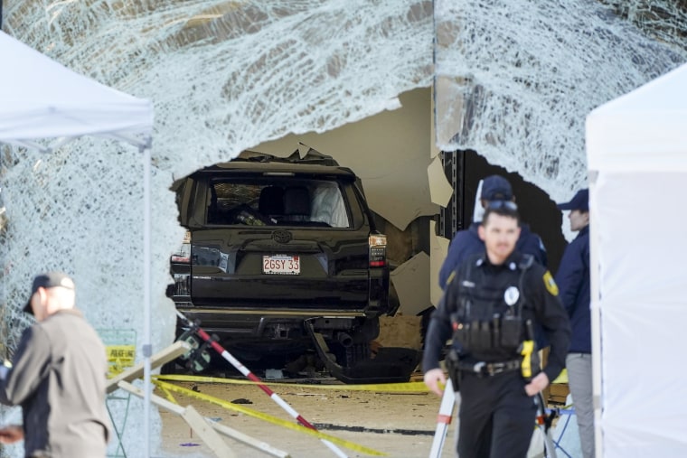 Police respond to the scene of a crash inside an Apple Store in Hingham, Mass., on Nov. 21, 2022.