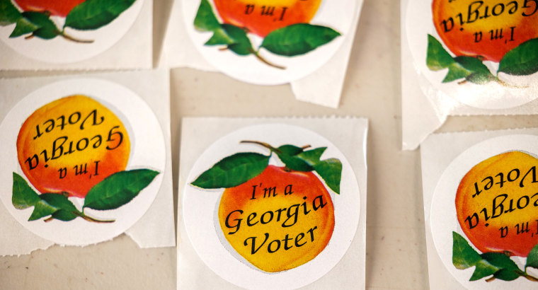 Image: Stickers with peaches and text that read,"I'm a Georgia Voter".