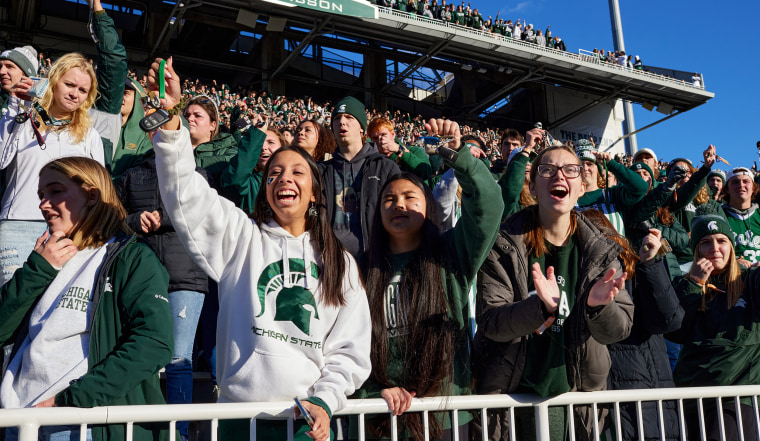 Image: Michigan State fans cheer  in the audience.