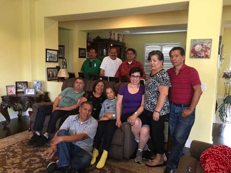 A family photo that includes the late Dolores Robledo, in the center, flanked by relatives.