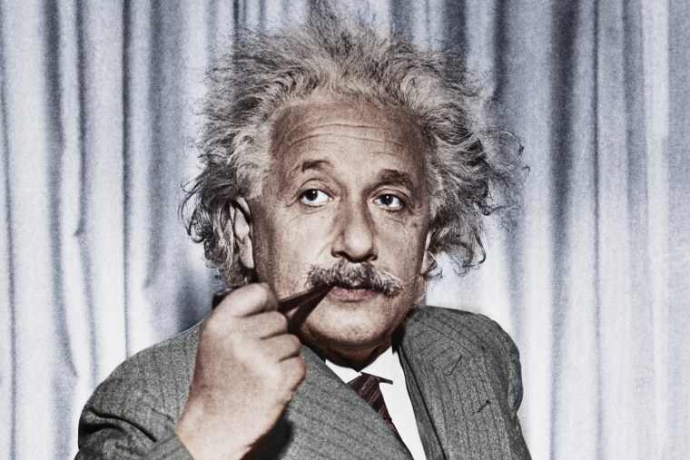 Albert Einstein smoking a pipe.