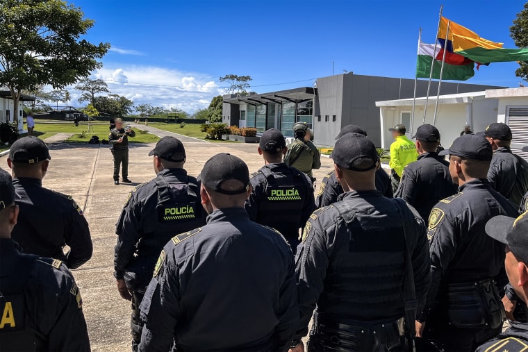 US and Colombian law enforcement gather for a tactical briefing ahead of an international human trafficking operation.