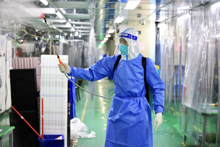 A worker disinfects the Foxconn factory