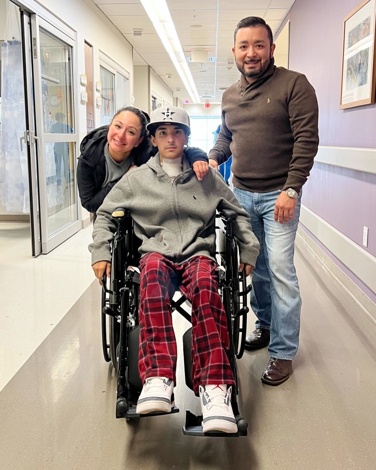 Erik Cantú with his parents leaving a hospital in San Antonio.