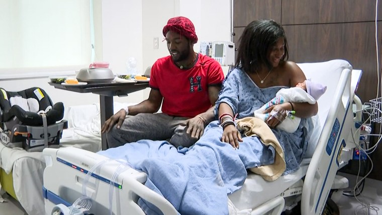 Alandria Worthy with her fiancee Deandre Phillips and their newborn daughter.