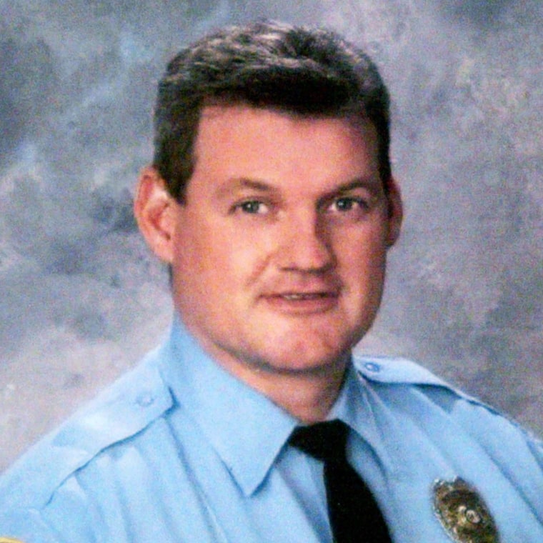 In this photo released Tuesday, July 5, 2005, by the Kirkwood Police Department Sgt. William McEntee, 43, is seen. McEntee was shot and killed while checking a fireworks disturbance in suburban St. Louis, and a search continued Wednesday for a man seen approaching the officer and firing several shots. Kirkwood Police Chief Jack Plummer said officers from several nearby departments and the Missouri State Highway Patrol joined Kirkwood police in searching for the suspect, who Plummer said frequented the neighborhood where the shooting took place. (AP Photo/Kirkwood Police Department via St. Louis Post-Dispatch)