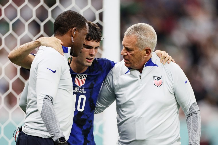Christian Pulisic receives medical treatment after scoring their side's first goal against Iran on Nov. 29, 2022, in Doha.