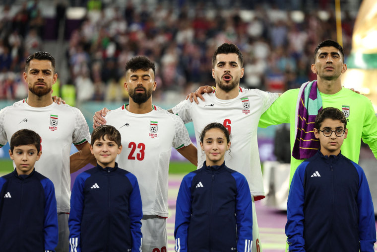 Iranian players, from left, Morteza Pouraliganji, Ramin Rezaeian, Saeid Ezatolahi and Alireza Beiranvand sing the national anthem prior to their World Cup match against the USA in Doha on Nov. 29, 2022.