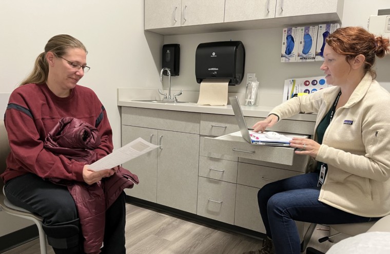 Bonnie Purk meets with nurse practitioner Andrea Storjohann at the Primary Health Care clinic