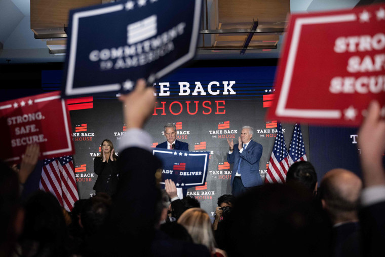 People applaud at an election night vigil party