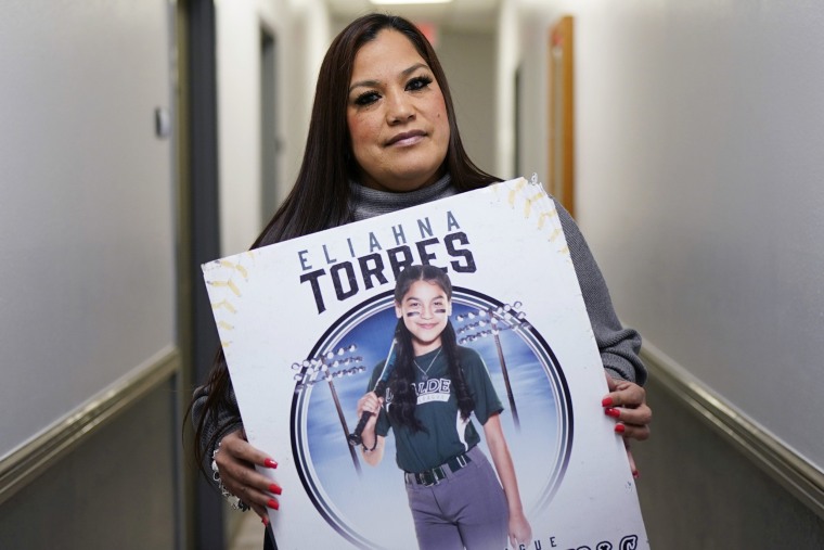 Sandra Torres, holds a photo of her daughter Eliahna, who was one of 19 students and two teachers killed in the school shooting in Uvalde, Texas.