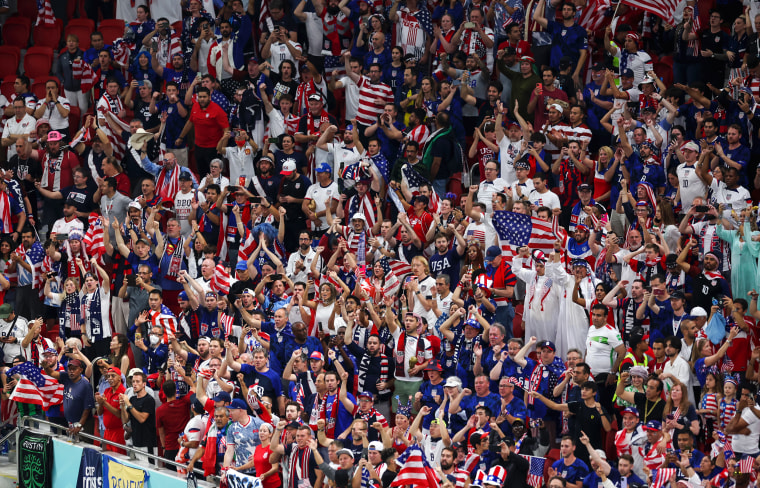 United States fans celebrate after their side's victory and progression into the knockout stages of the World Cup on Nov. 29, 2022, in Doha.