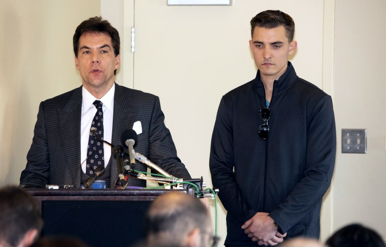 Jack Burkman, left, and Jacob Wohl speak with reporters in Rosslyn, Virginia.