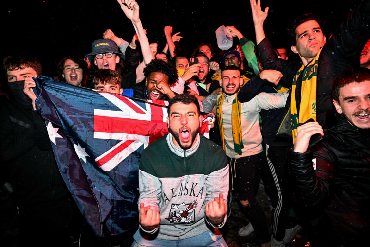 Australian fans celebrate in Melbourne on Dec. 1, 2022, after Australia's World Cup victory over Denmark put them in the knockout stage.