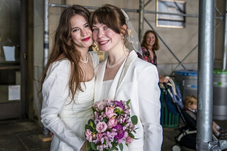 Savannah and Joanna celebrate after their civil service marriage Oct. 13, 2022 at Borough Hall in Brooklyn, N.Y.